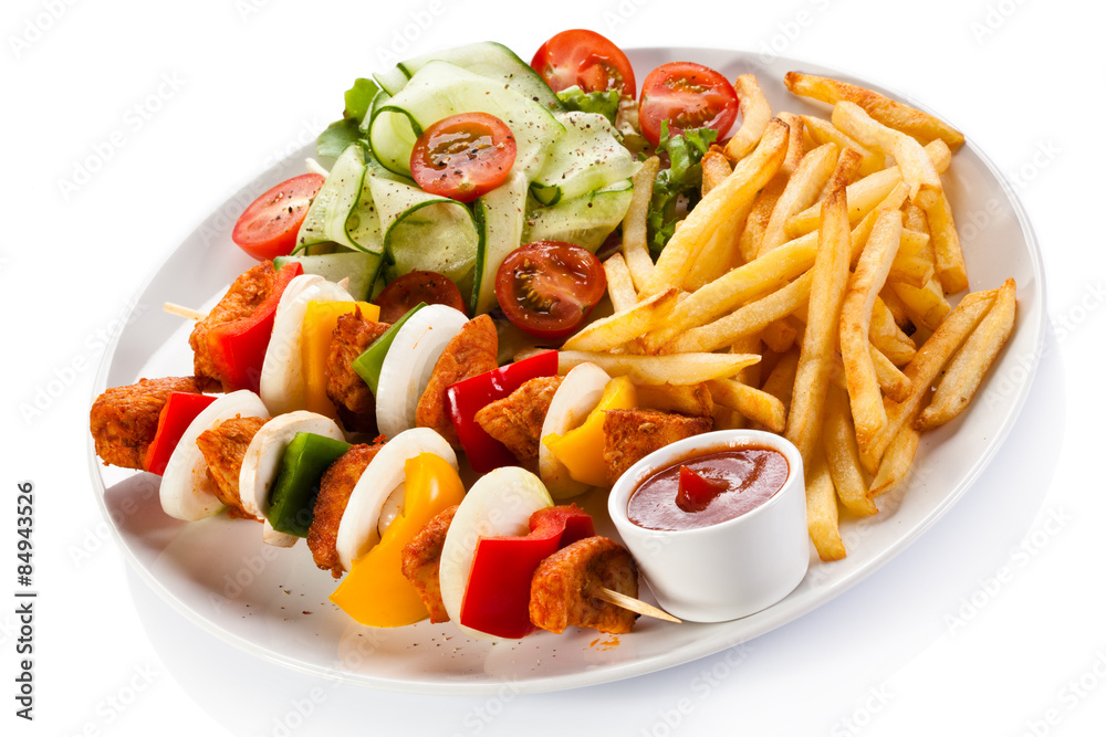 Grilled meat, chips and vegetables Grilled meat, chips and vegetables