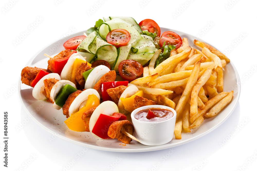 Grilled meat, chips and vegetables Grilled meat, chips and vegetables