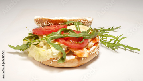 Fresh bagel sandwich isolated over white background
