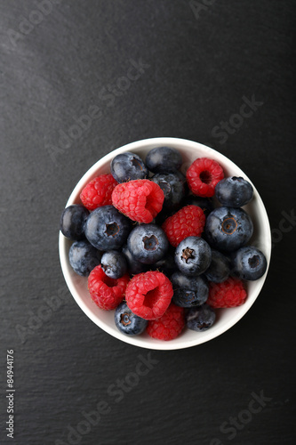 Raspberries and blueberries in a bowl