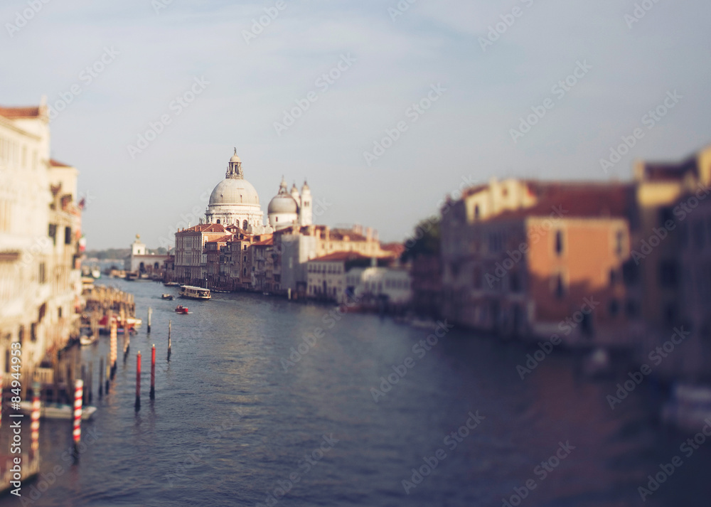 Vintage photo of Grand canal of Venice in tilt shift. Church Santa Maria della Salute