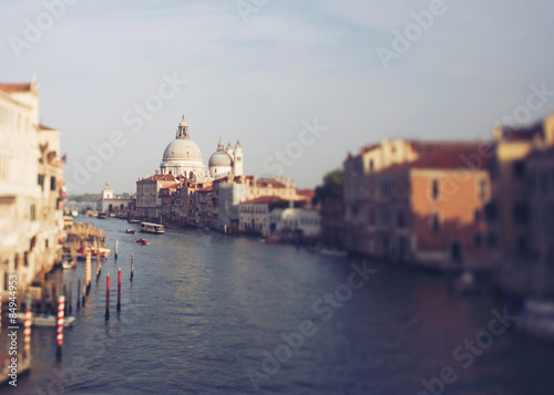 Vintage photo of Grand canal of Venice in tilt shift. Church Santa Maria della Salute