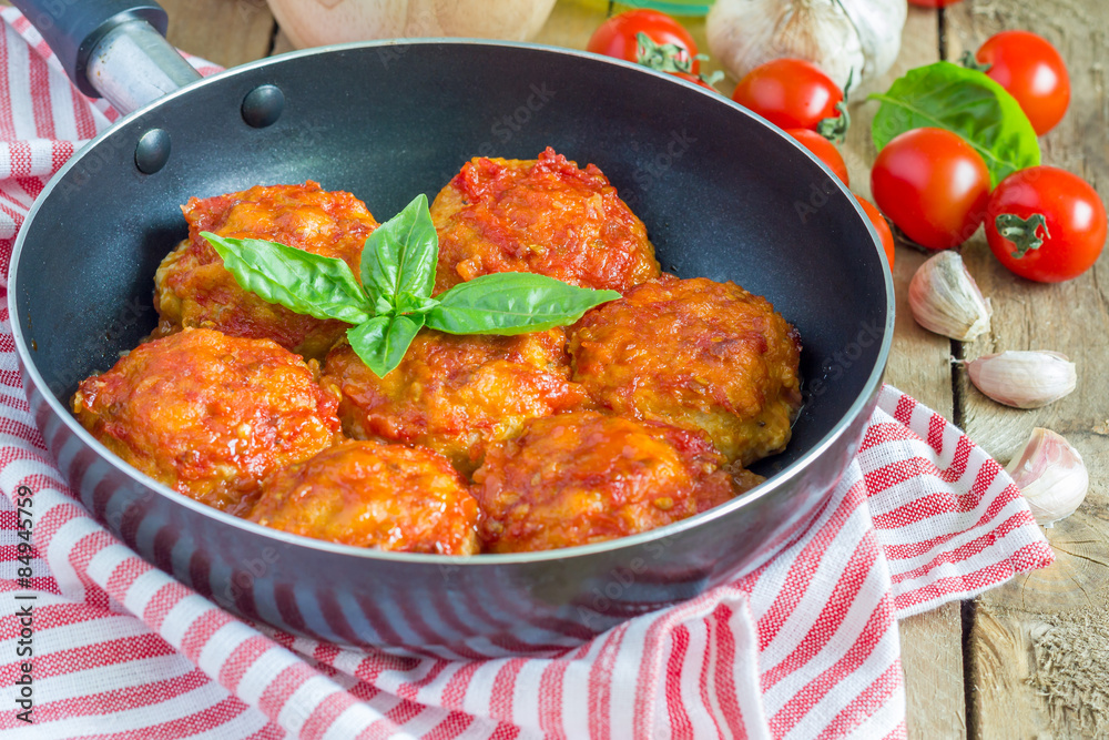 Meatballs with tomato sauce in frying pan Meatballs with tomato sauce in frying pan