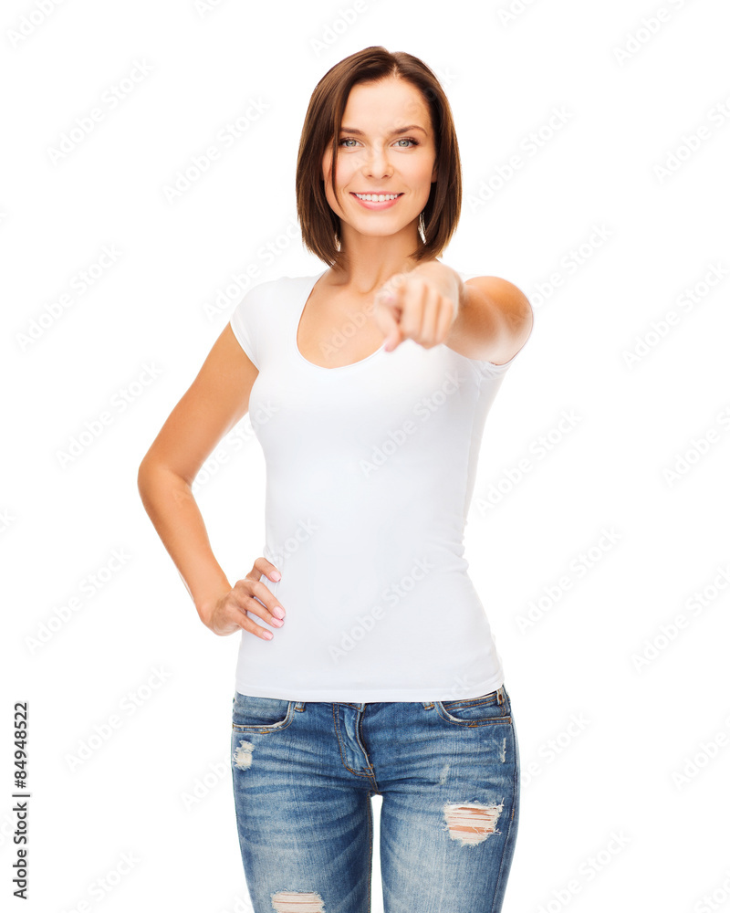 happy woman in blank white t-shirt pointing at you happy woman in blank white t-shirt pointing at you