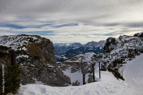 Snowy mountain landscape under a dramatic sky