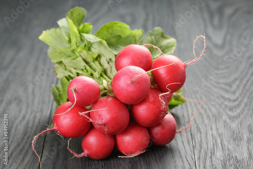 freshly harvested radishes on rustic table