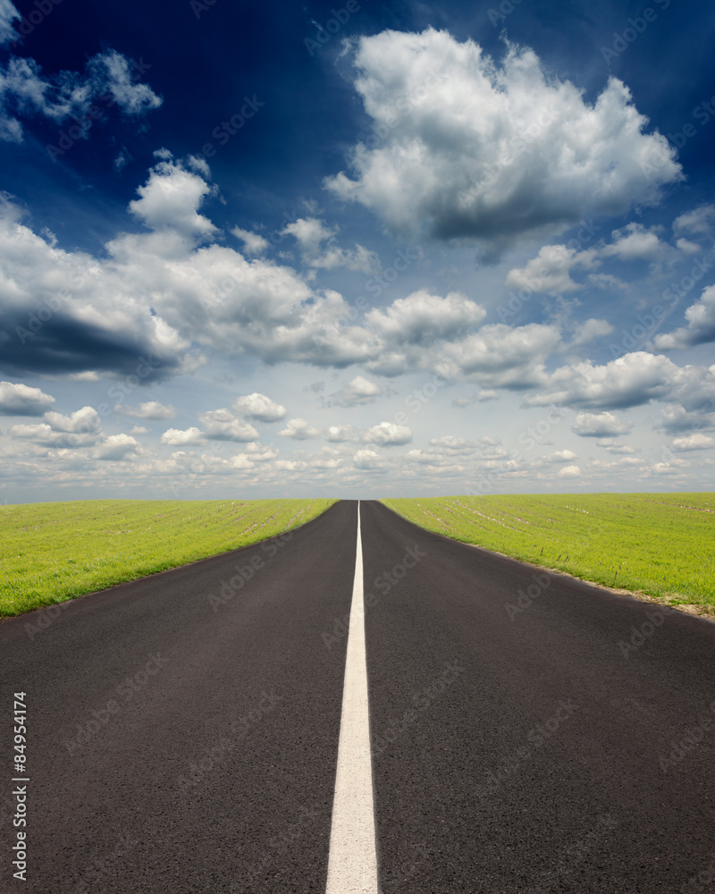 Driving uphill on an empty road at idyllic sunny day