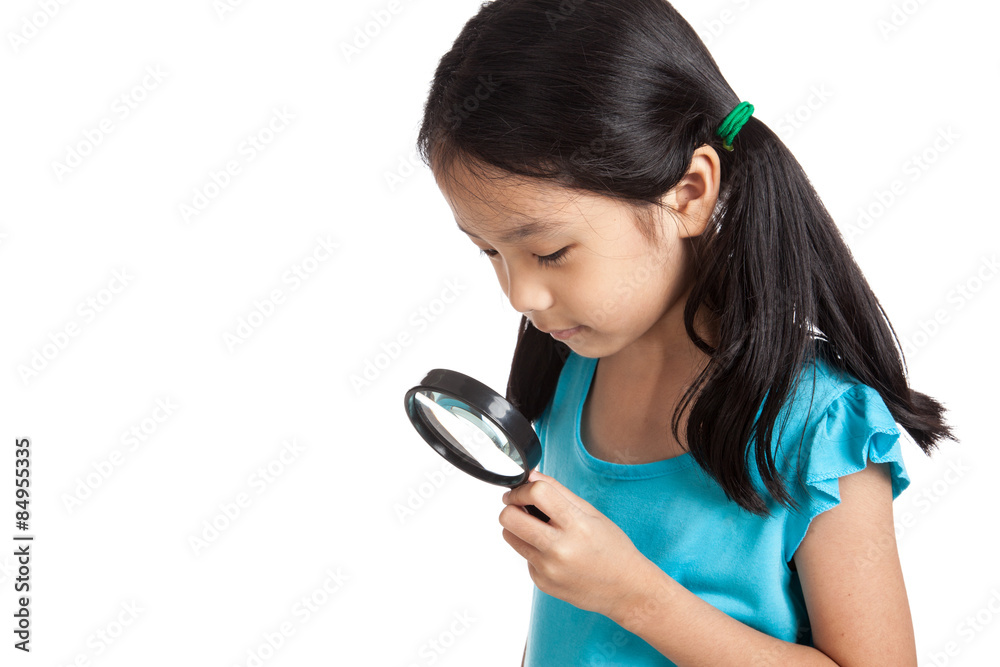 Little asian girl with magnifying glass Little asian girl with magnifying glass