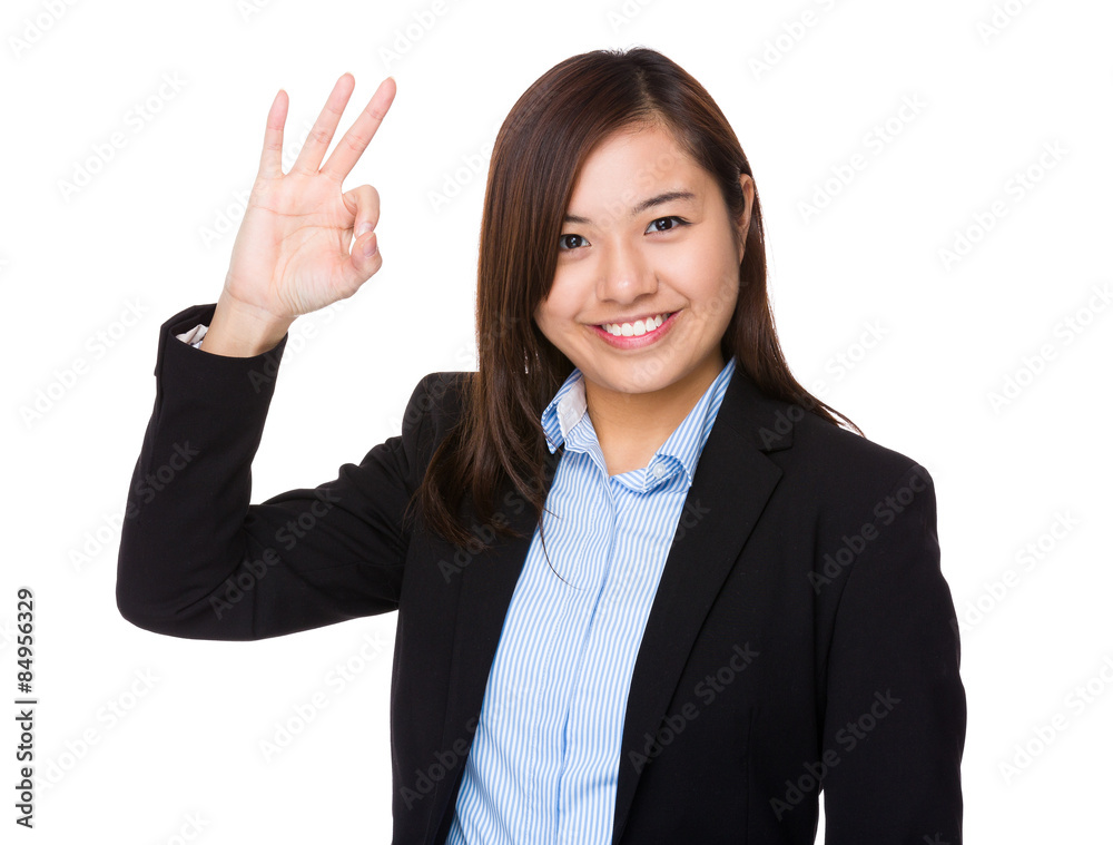 Businesswoman with ok sign gesture Businesswoman with ok sign gesture