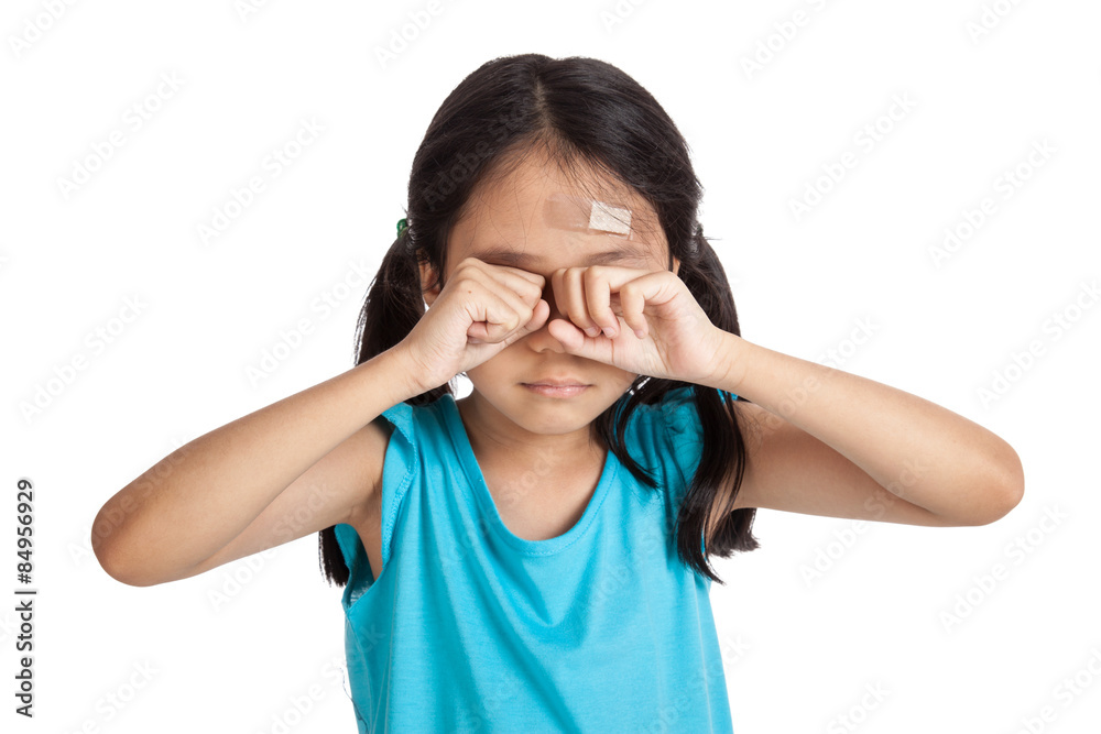 Little asian girl cry with bandage on forehead Little asian girl cry with bandage on forehead
