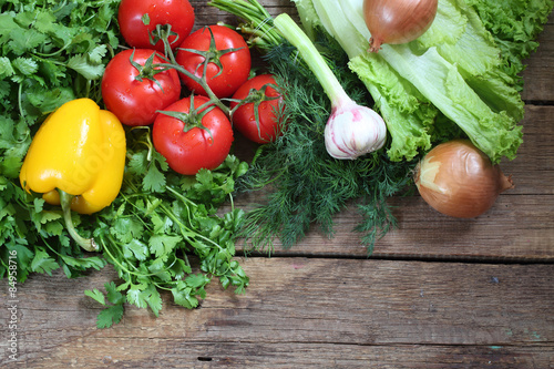 Fresh vegetables: tomatoes, pepper, an onions, garlic, a coriand