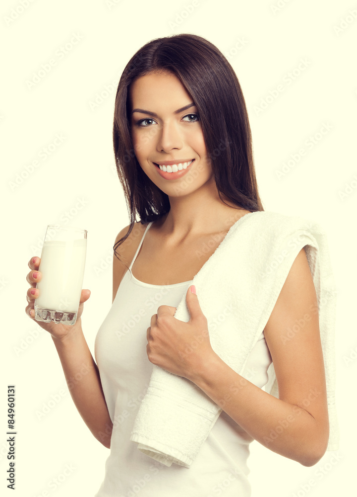 Smiling brunette woman drinking milk Smiling brunette woman drinking milk