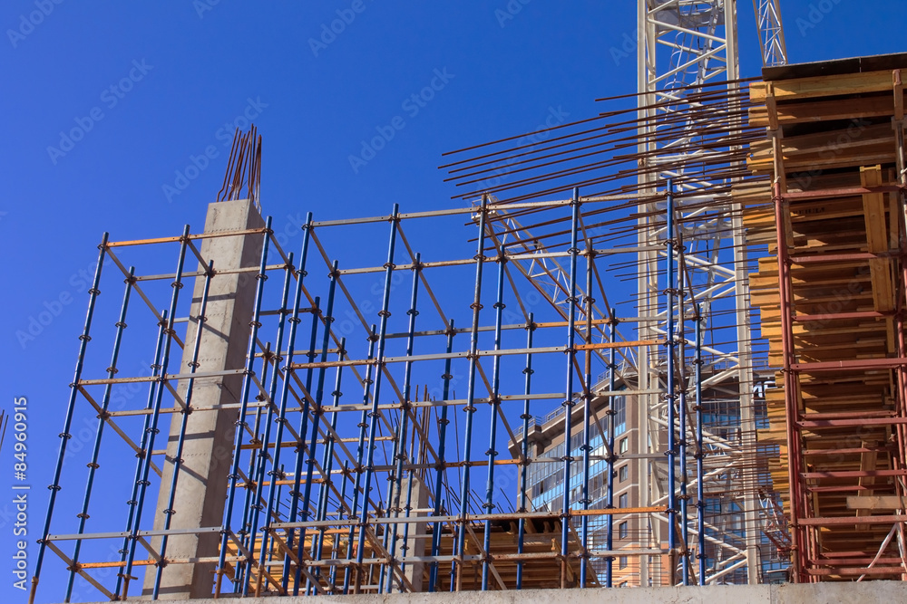Construction site against blue sky with clouds