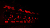 guitar amplifier control panel in red light