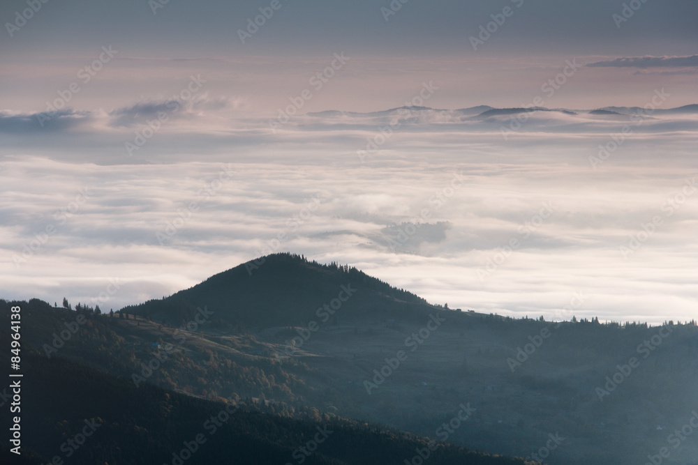 Landscape misty mountains in the morning sunlight.