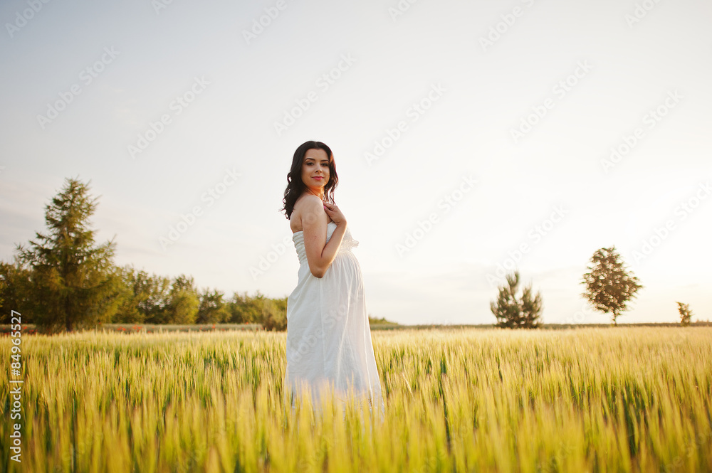 pregnant gorgeous brunette woman on the field with wheat and pop pregnant gorgeous brunette woman on the field with wheat and pop