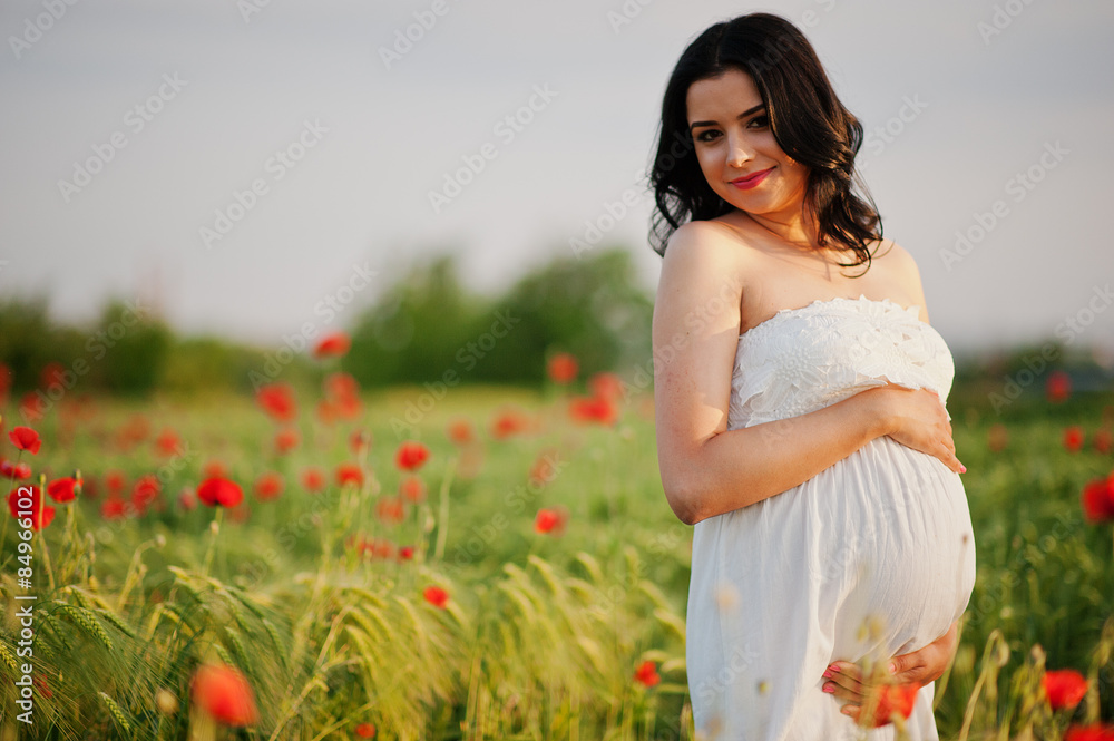 pregnant gorgeous brunette woman on the field with wheat and pop pregnant gorgeous brunette woman on the field with wheat and pop