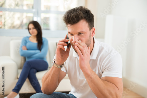Man Talking Privately On Cellphone