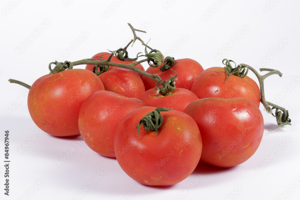 Natural fresh tomatoes on white