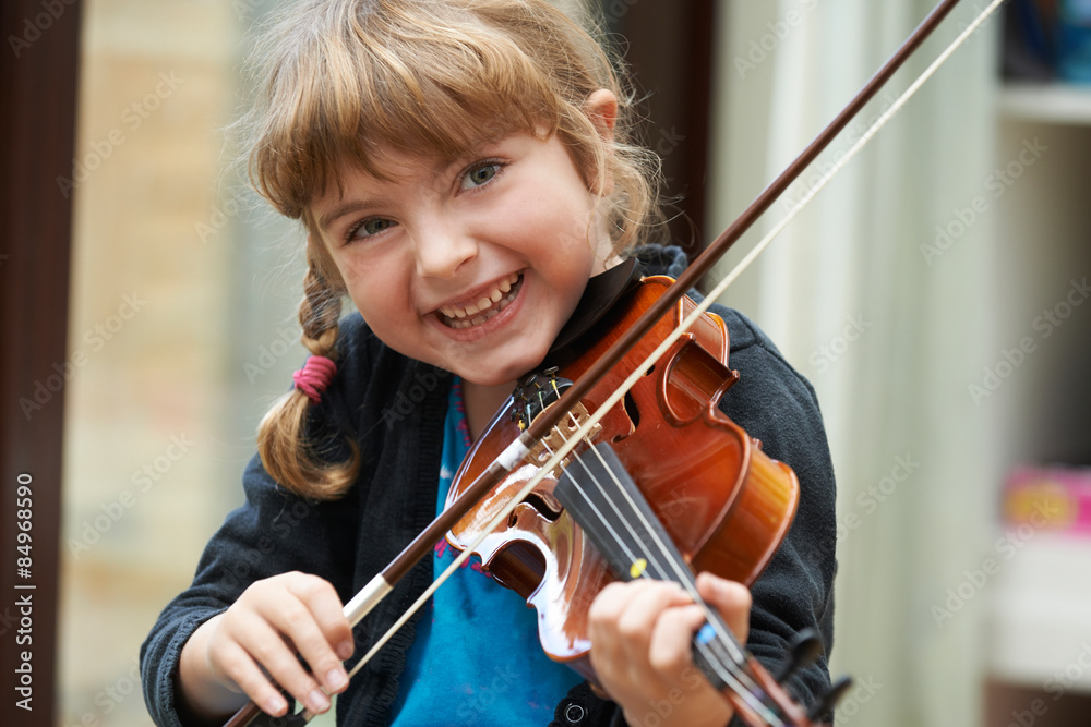 Portrait Of Young Girl Learning To Play Violin Portrait Of Young Girl Learning To Play Violin