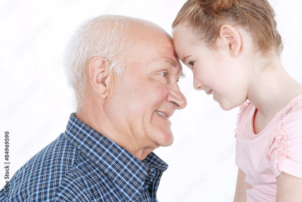 Grandfather having fun with his granddaughter Grandfather having fun with his granddaughter