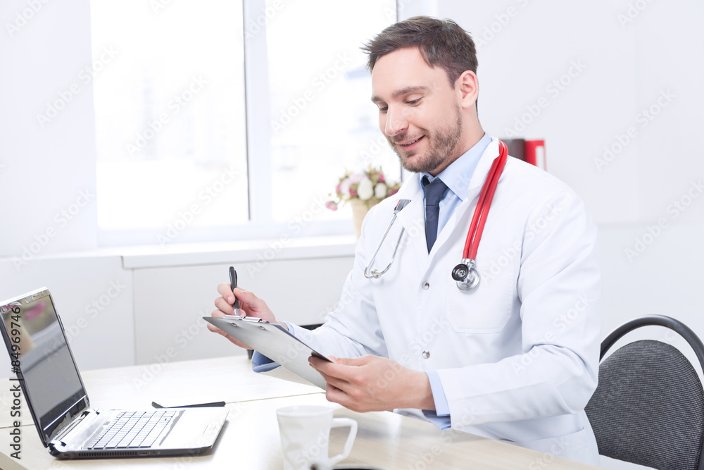 Healthy cardiologist holding the folder Healthy cardiologist holding the folder