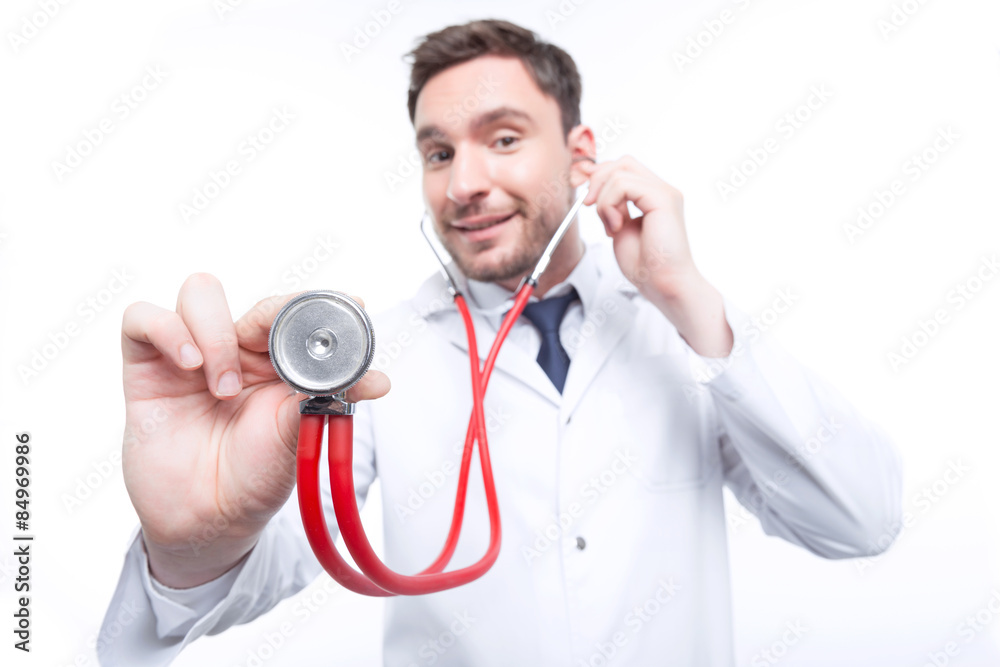 Professional cardiologist holding stethoscope Professional cardiologist holding stethoscope