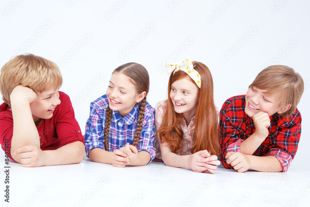 Smiling children lying on the floor in raw Smiling children lying on the floor in raw