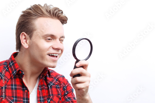 Agreeable guy keeping loupe