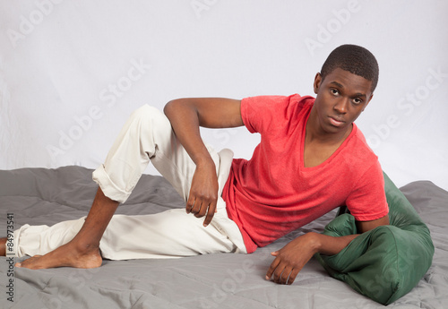 Thoughtful black man reclining