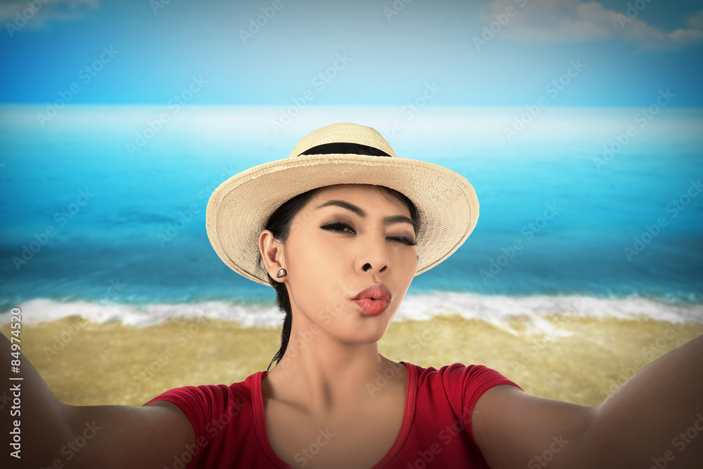 Woman take selfie on the beach