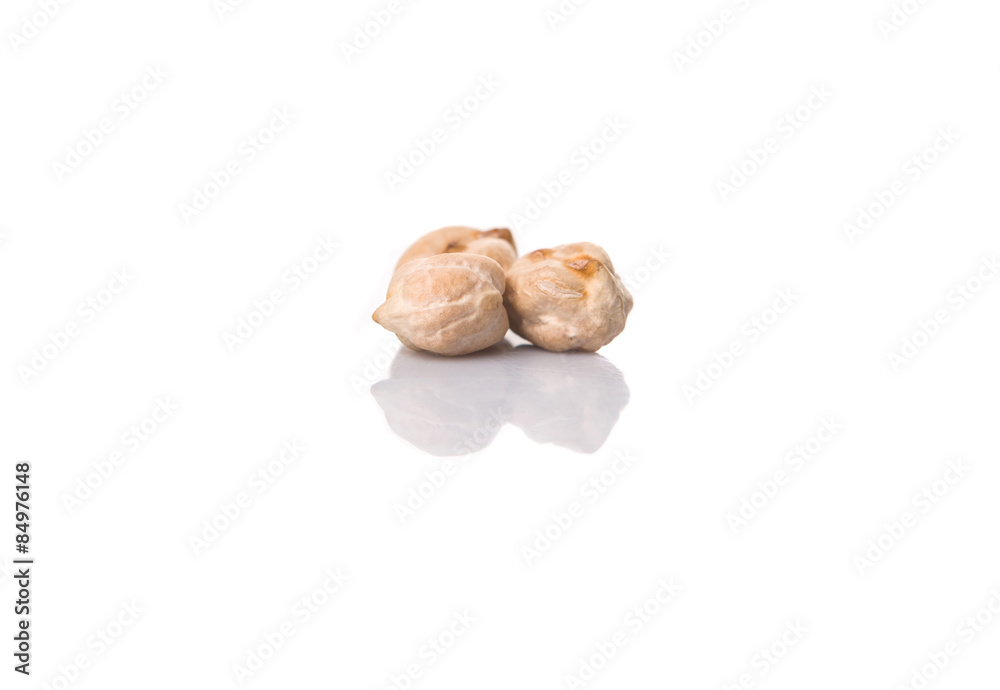 Raw chickpeas over white background