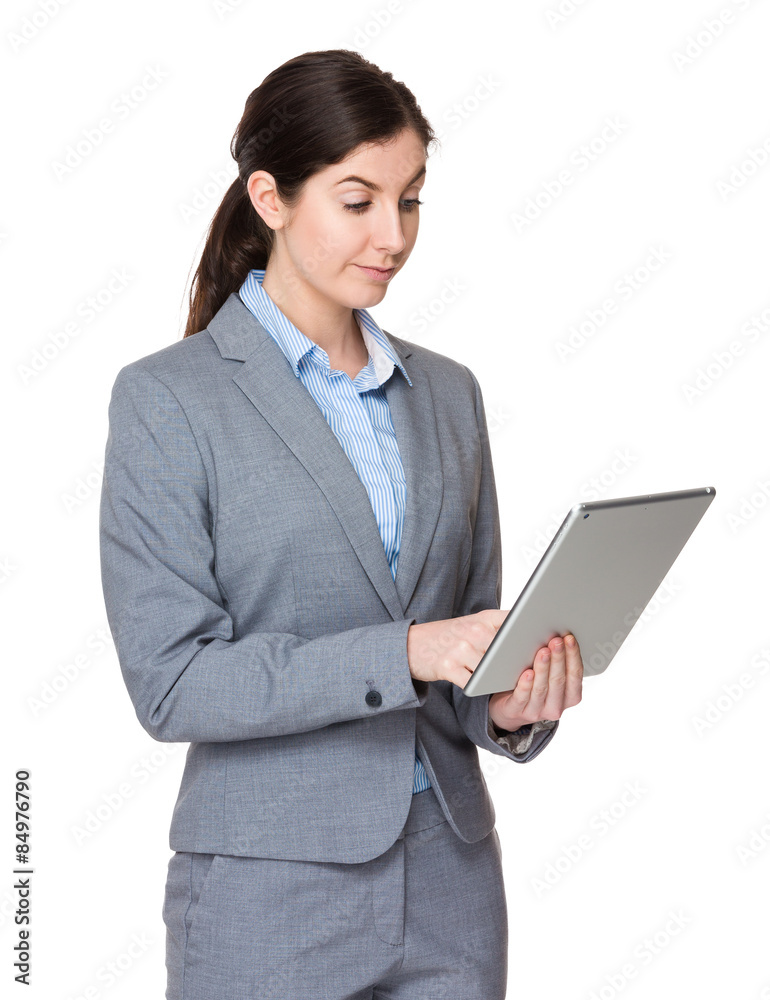Brunette businesswoman use of digital tablet Brunette businesswoman use of digital tablet