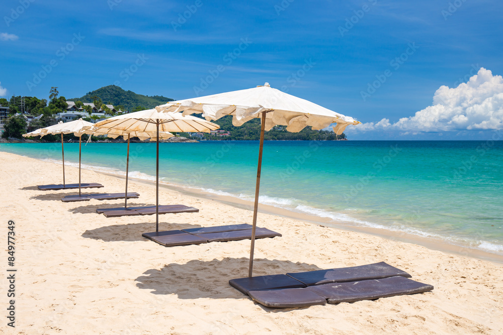 beach umbrella on beach with blue sky, phuket thailand