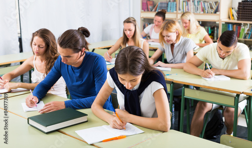Obraz na plátně Serious student listening attentively