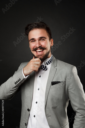 handsome guy with beard and mustache in suit
