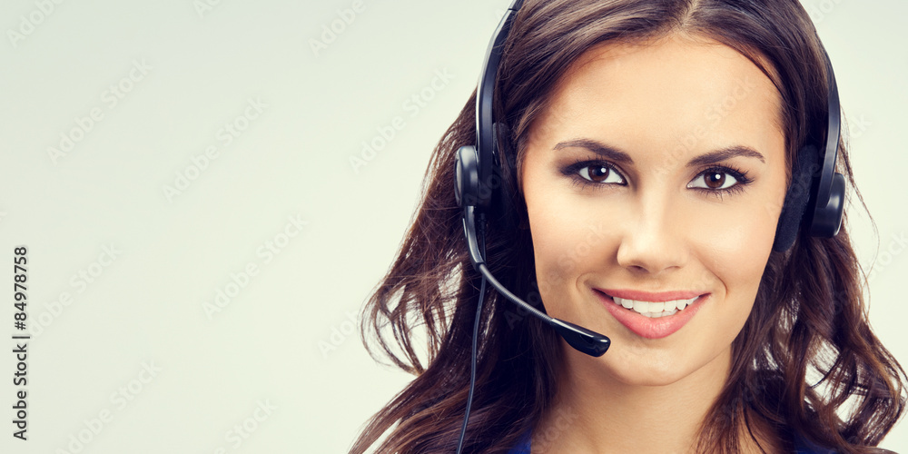 Cheerful smiling young support phone operator Cheerful smiling young support phone operator