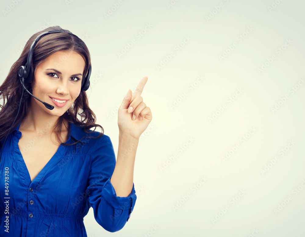 Cheerful support phone operator showing copyspace Cheerful support phone operator showing copyspace