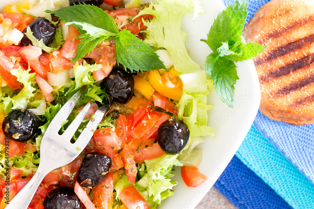 Fresh Mediterranean salad with toasted bread