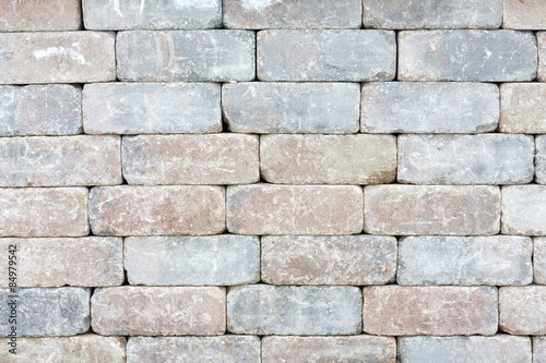 Background texture of a tumbled brick wall