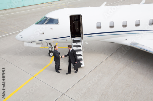 executive manager leaving corporate jet
