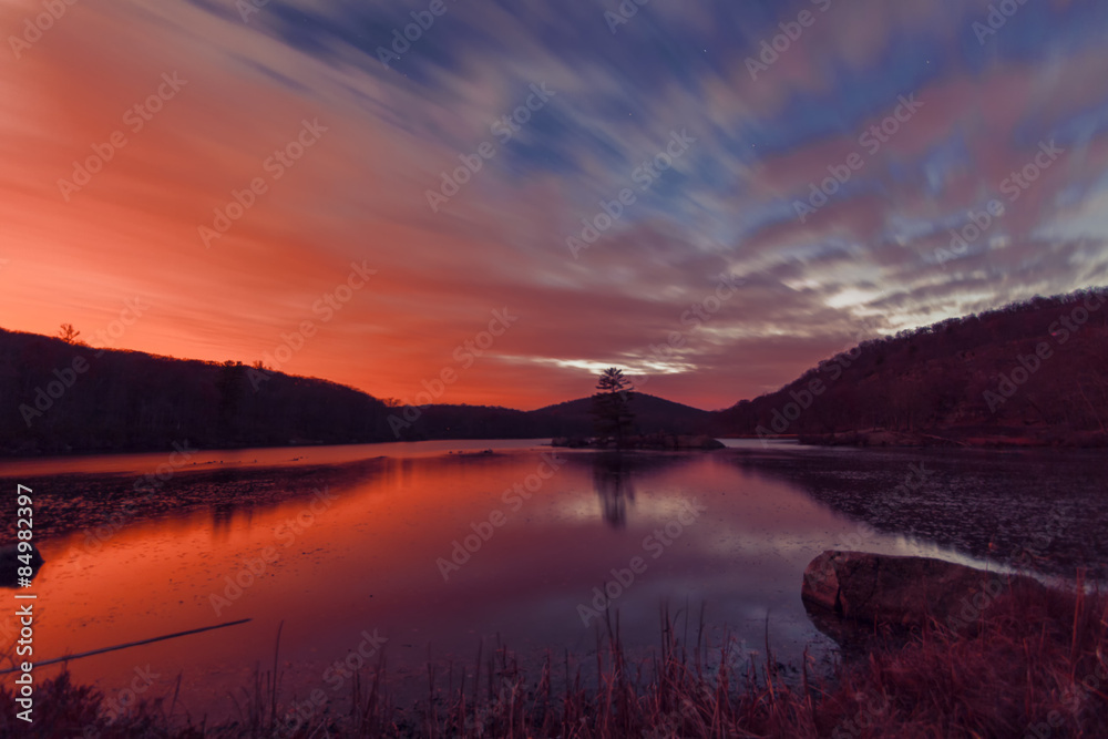 Fototapeta premium Sunset on the forest lake.