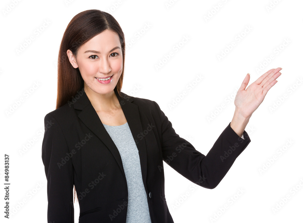 Asian businesswoman with hand showing something Asian businesswoman with hand showing something