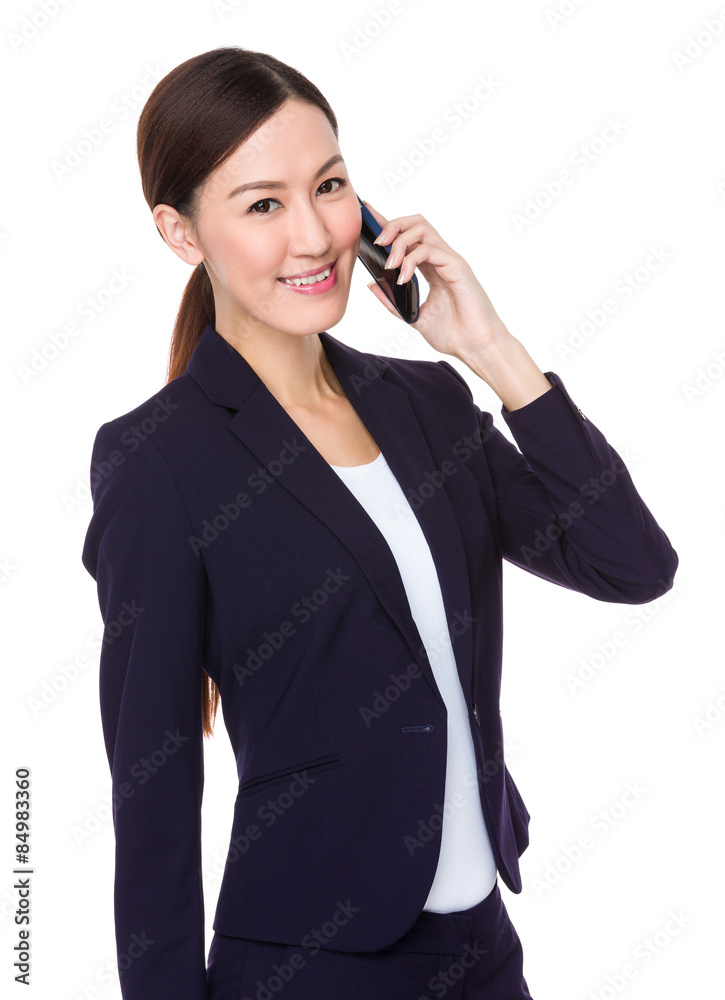 Young businesswoman talk to mobile phone Young businesswoman talk to mobile phone