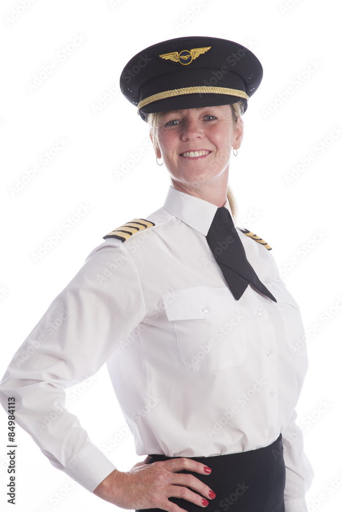 Attractive female airline pilot standing in uniform Attractive female airline pilot standing in uniform