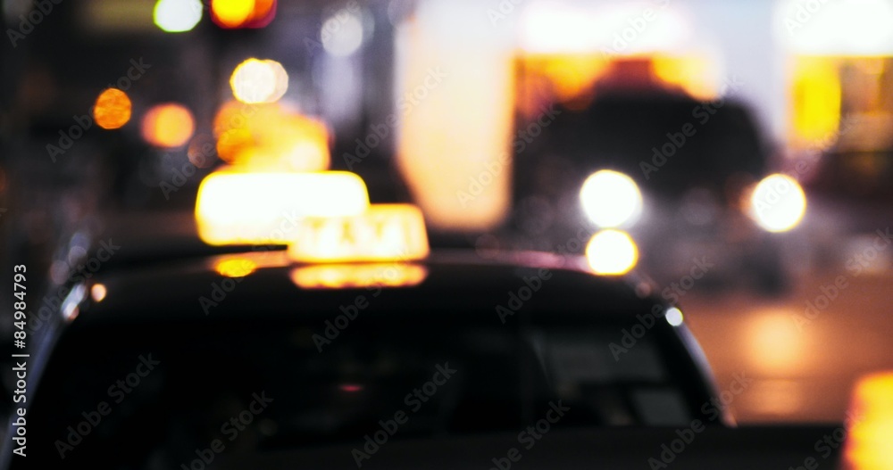 Yellow taxi symbol on roof of cab. Abstract background of city transportation 