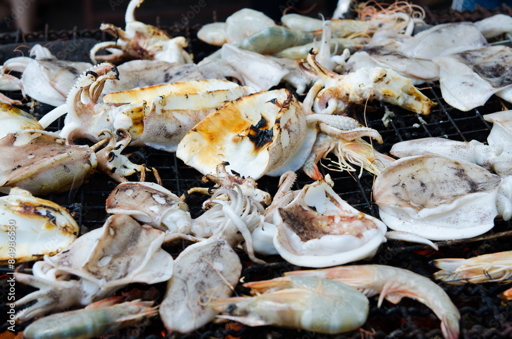 Grilled and calamari prawns on Stove Thai Style for at Seafood Grilled and calamari prawns on Stove Thai Style for at Seafood