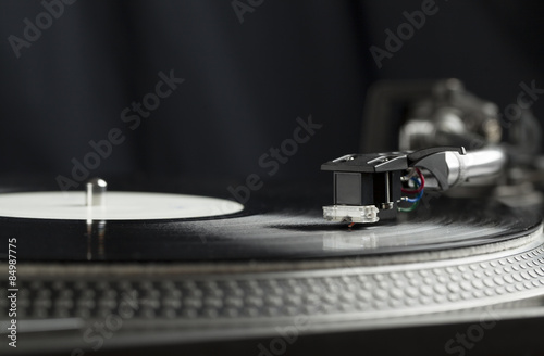 Obraz na płótnie Turntable playing vinyl close up with needle on the record