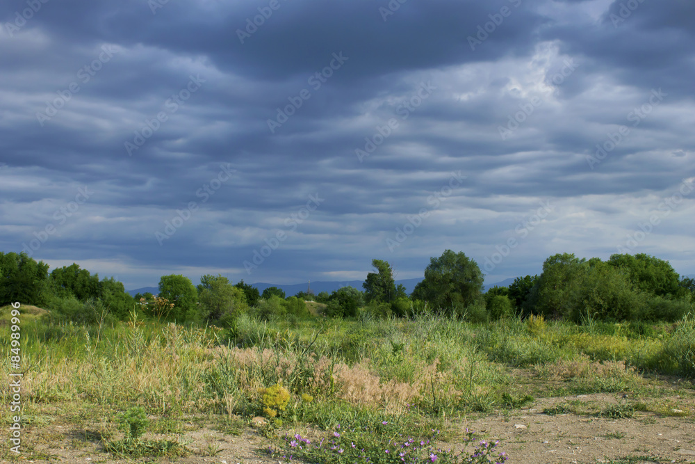 Summer landscape with storm clouds 