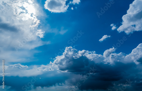 Sun and clouds on a blue sky © vachev